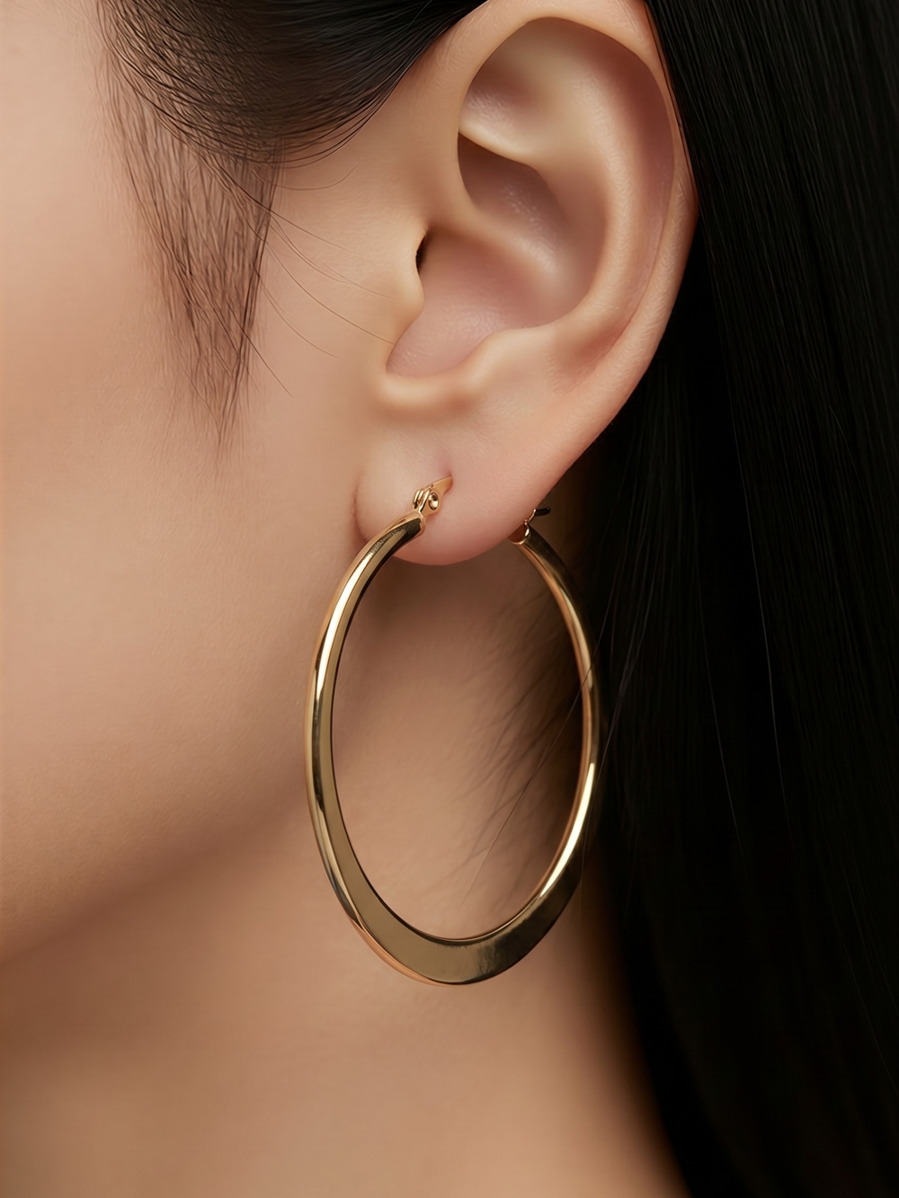 Laundry by Shelli Segal hoop earrings feature a flat, gold-toned design